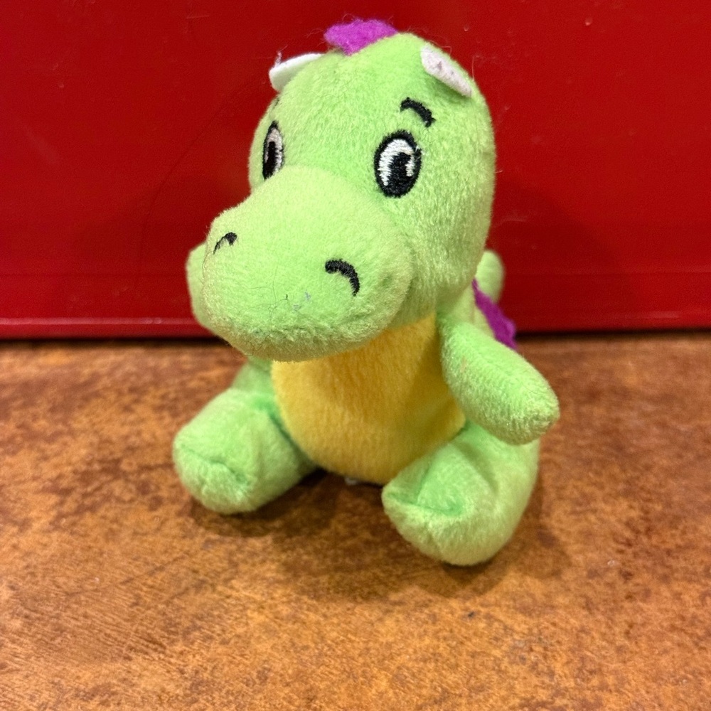 Green Plush Dinosaur Toy with Yellow Belly